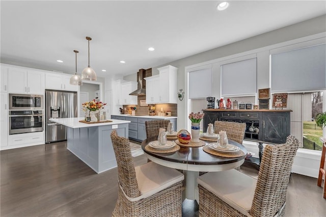 dining area featuring dark wood-style floors and recessed lighting