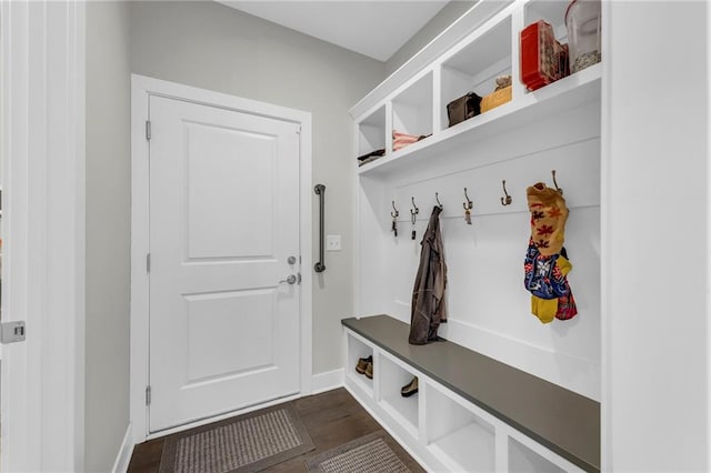 mudroom featuring dark wood-style floors and baseboards