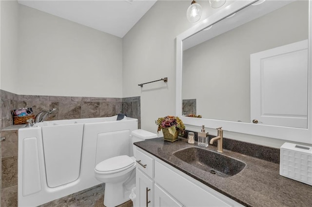 full bathroom featuring tile walls, vanity, toilet, and a bath