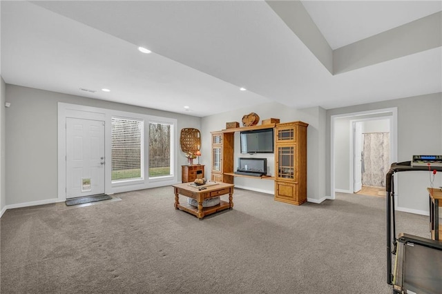 carpeted living room featuring visible vents, baseboards, and recessed lighting