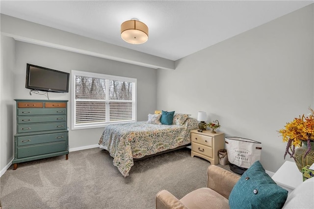 bedroom featuring carpet and baseboards