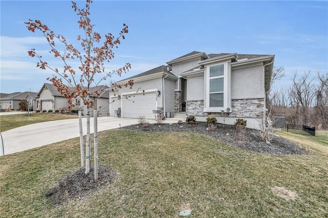 view of front of property featuring an attached garage, stone siding, driveway, stucco siding, and a front lawn