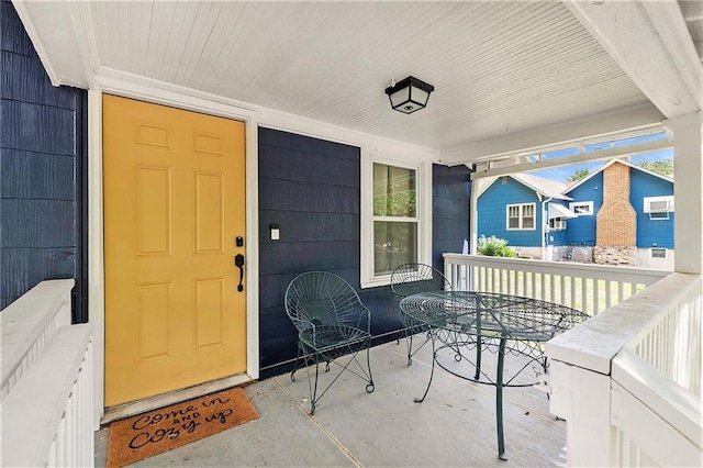 entrance to property featuring a porch