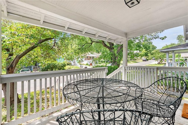 wooden deck with outdoor dining space