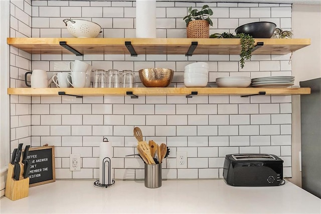 interior details featuring open shelves and light countertops