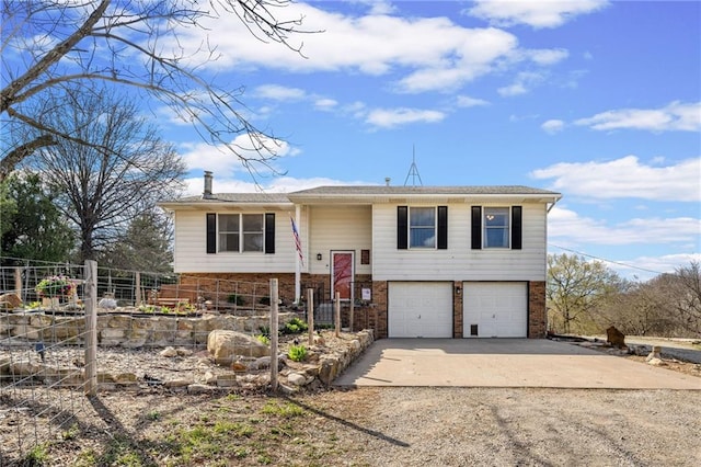 17259 174th St, Basehor, KS 66007 - raised ranch featuring driveway, brick siding, and a garage