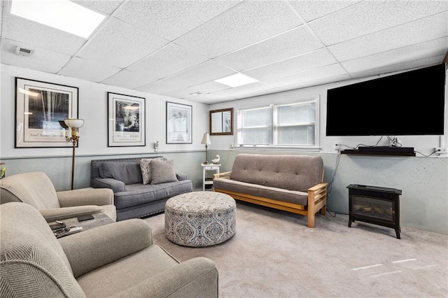 17259 174th St, Basehor, KS 66007 - carpeted living room with a paneled ceiling and a wood stove