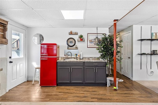 17259 174th St, Basehor, KS 66007 - bar featuring fridge, a sink, a drop ceiling, and wood finished floors