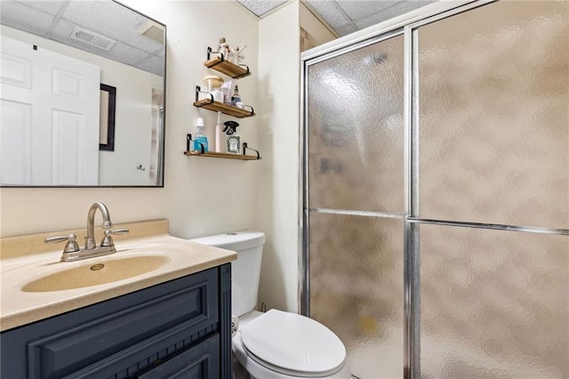 17259 174th St, Basehor, KS 66007 - full bath featuring a drop ceiling, toilet, vanity, and a shower stall