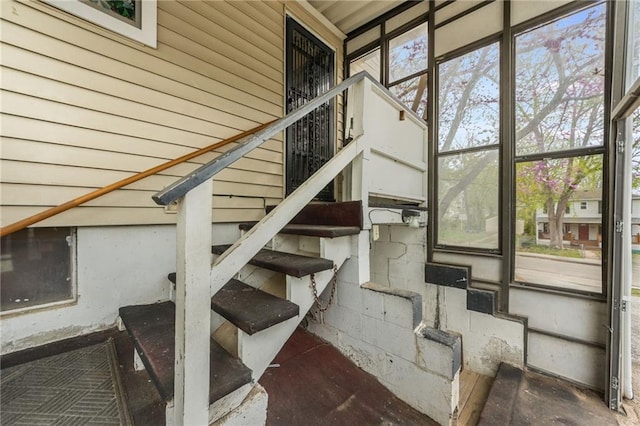 stairs with concrete block wall