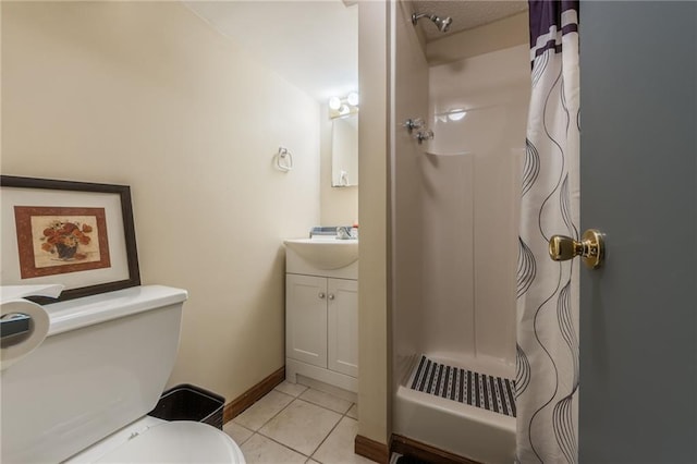full bathroom with toilet, vanity, a shower with curtain, tile patterned flooring, and baseboards