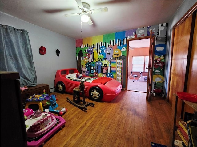 bedroom featuring wood-type flooring and ceiling fan