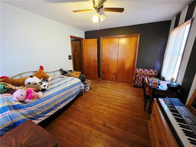 bedroom with ceiling fan and wood finished floors