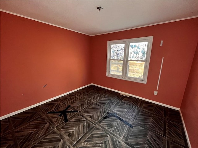 spare room featuring baseboards