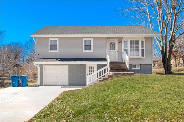 view of front of property with entry steps, a garage, fence, concrete driveway, and a front lawn