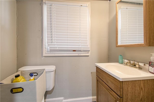 half bathroom featuring toilet and vanity