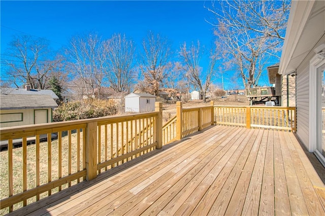 deck featuring a residential view and an outdoor structure