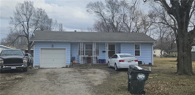 view of front of house featuring a shingled roof, covered porch, and an attached garage