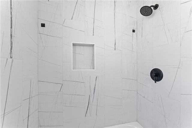 bathroom featuring tiled shower