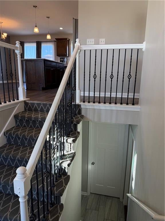 staircase featuring wood finished floors