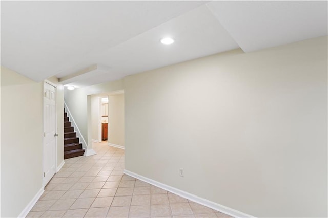 unfurnished room featuring stairway, light tile patterned flooring, recessed lighting, and baseboards