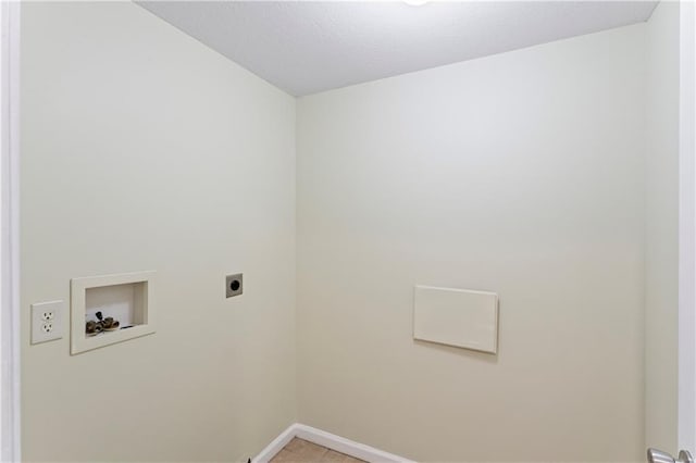 washroom featuring electric dryer hookup, a textured ceiling, baseboards, hookup for a washing machine, and laundry area