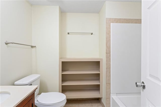 full bath with tile patterned flooring, toilet, a textured ceiling, and vanity