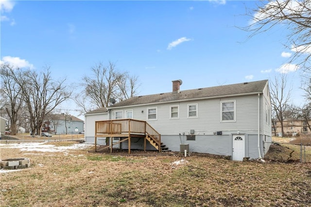 rear view of house with stairs and a deck