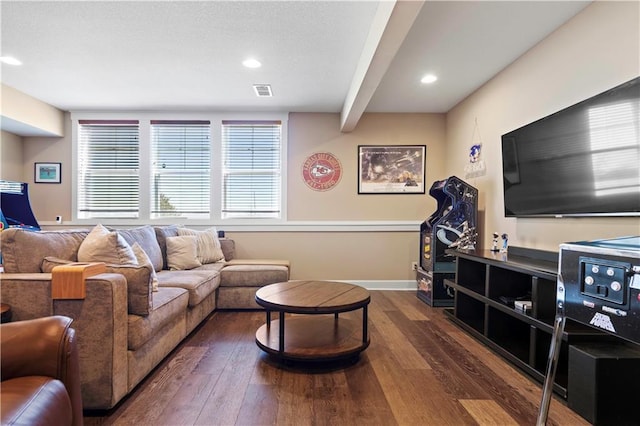 living room with baseboards, dark wood finished floors, and recessed lighting