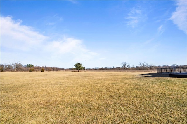 view of yard with a rural view