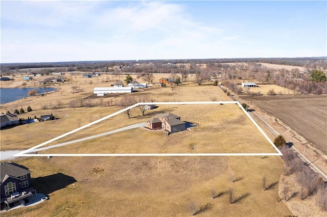 bird's eye view with a rural view and a water view