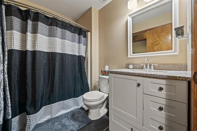 full bathroom with a shower with curtain, vanity, and toilet