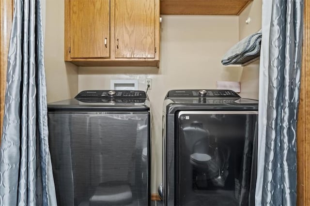 washroom featuring washer and dryer