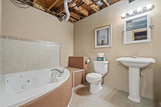 full bathroom with tile patterned flooring, toilet, and a tub with jets