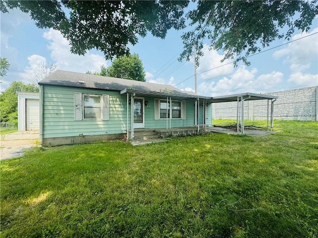 view of front of house with a garage and a front lawn