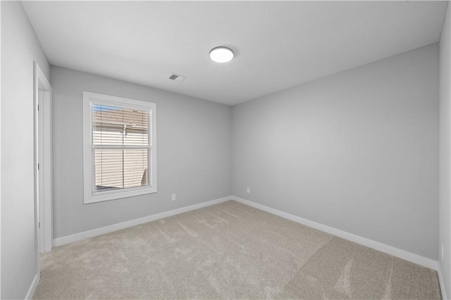 16967 S Hunter St, Olathe, KS 66062 - empty room featuring visible vents, baseboards, and light colored carpet