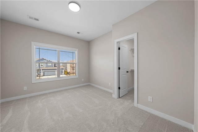 16967 S Hunter St, Olathe, KS 66062 - spare room featuring light carpet, baseboards, and visible vents