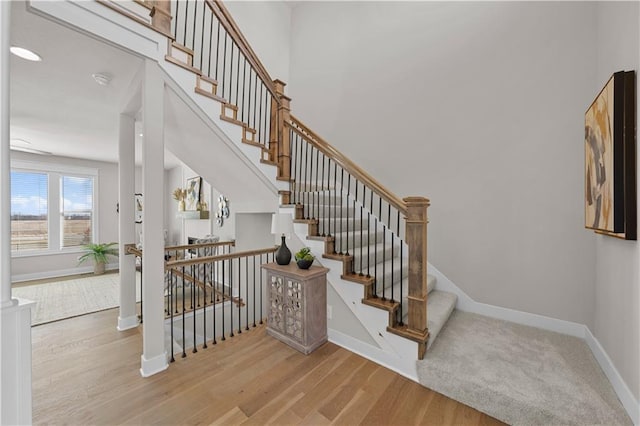 16967 S Hunter St, Olathe, KS 66062 - stairway featuring baseboards and wood finished floors