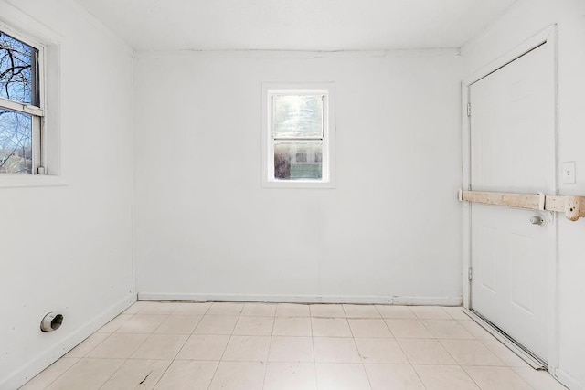 empty room featuring baseboards