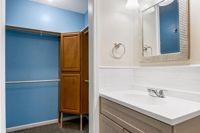 bathroom with decorative backsplash and vanity