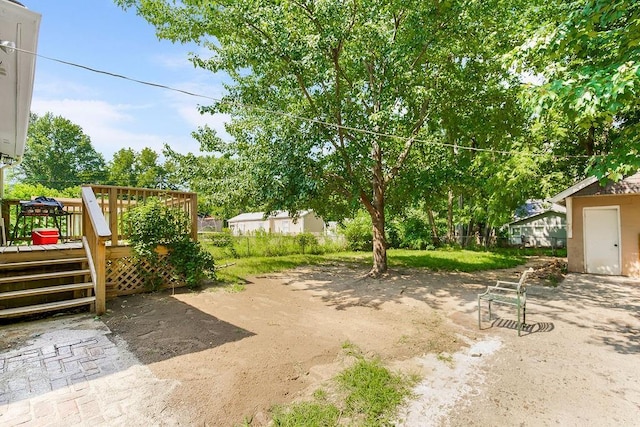 view of yard featuring a deck