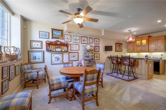 dining space with recessed lighting, light colored carpet, ceiling fan, and baseboards