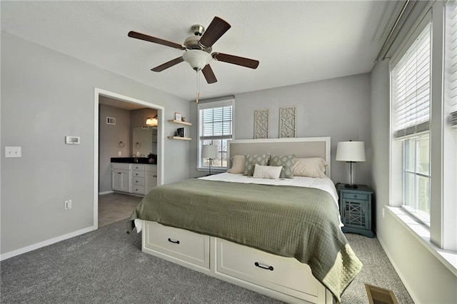 16059 Fontana St Unit 205, Overland Park, KS 66085 - bedroom featuring carpet floors, baseboards, visible vents, and ensuite bath