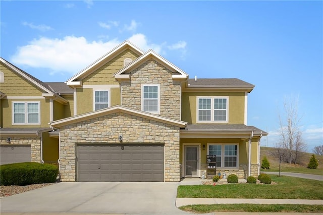 16059 Fontana St Unit 205, Overland Park, KS 66085 - view of front of home featuring covered porch, driveway, stone siding, and stucco siding