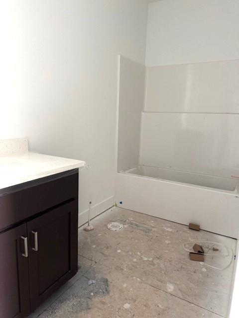 bathroom featuring vanity and a bathing tub