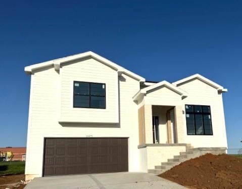 19475 S Amherst St, Gardner, KS 66030 - view of front of home featuring an attached garage and driveway