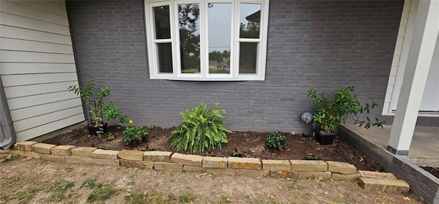 view of home's exterior with brick siding