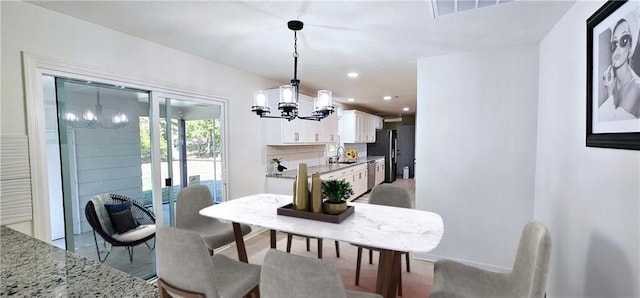 dining area with recessed lighting, visible vents, and an inviting chandelier