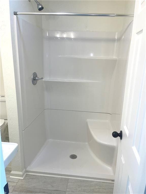 bathroom with a stall shower