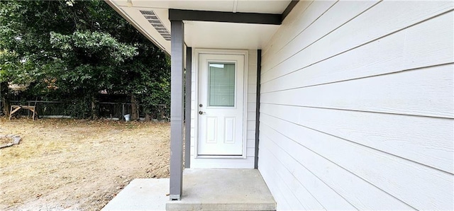 property entrance with fence